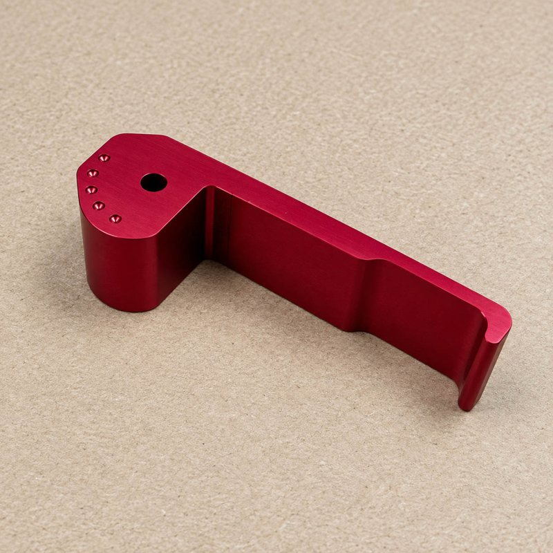 Red anodized lever with drilled mounting holes